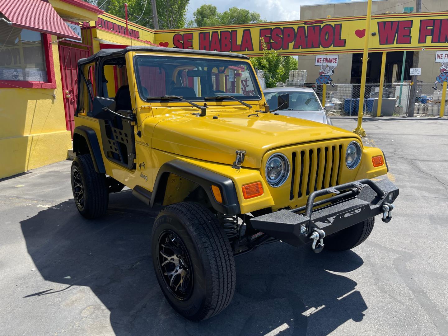 2000 Solar Yellow /Black Jeep Wrangler SE (1J4FA29P9YP) with an 2.5L 4 Cyl. engine, Manual transmission, located at 801 South State Street, Salt Lake City, UT, 84111, (801) 328-0098, 40.751953, -111.888206 - Wow extremely rare to find extra clean Jeep in immaculate condition 4x4! Low miles only 98,248 miles! Interior and exterior are both in excellent shape for the year. This is a clean title no reported accidents on the CarFax history report. It has passed emissions already and is ready to go. Featur - Photo#5